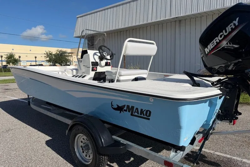 Slide: The Image of 2027 Mako Pro Skiff 17 CC boat with Mercury engine on trailer. - 2