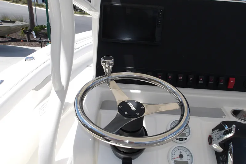 Slide: The Image of Steering console of 2027 Mako 226 Center Console boat with modern controls. - 15