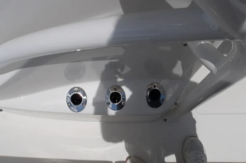 Slide: The Image of 2027 Mako 226 Center Console boat with three stainless steel rod holders. - 16