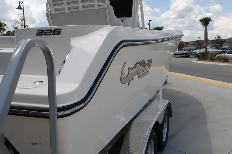 Slide: The Image of 2027 Mako 226 Center Console boat on trailer, outdoor display. - 20