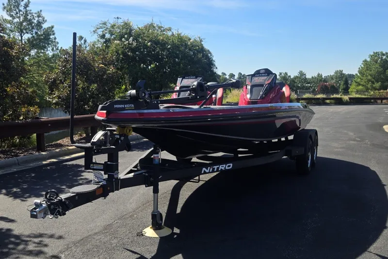 Slide: The Image of 2027 Nitro Z19 XL boat on trailer in sunny outdoor setting. - 4