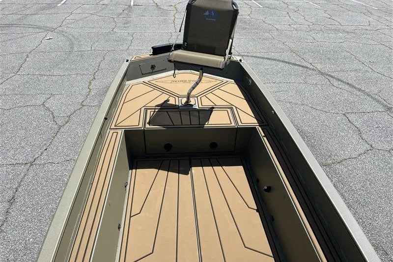 Slide: The Image of 2027 Tracker Grizzly 1650 T Prairie Wings Edition boat interior with seating and storage. - 42