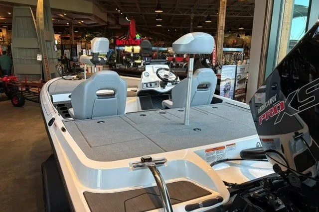 Slide: The Image of 2027 Nitro Z19 XL boat interior with seating and control panel in showroom. - 2