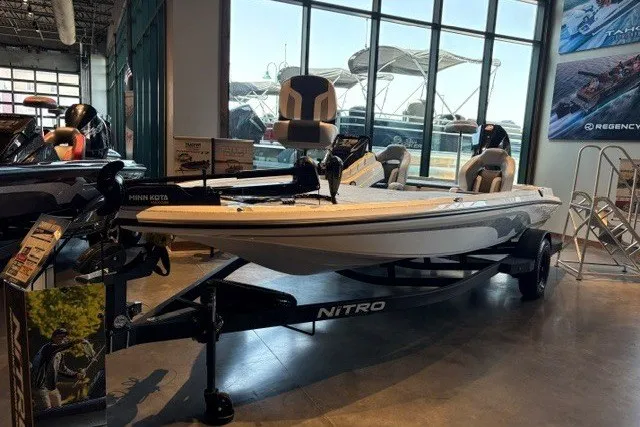 The Image of 2027 Nitro Z19 XL boat displayed in a showroom with modern seating and equipment. - 0