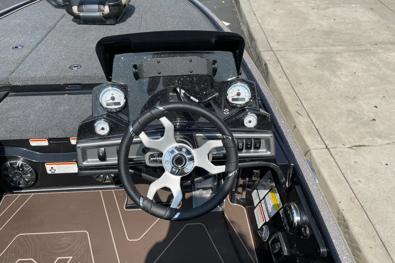 Slide: The Image of Steering console of a 2027 Nitro Z19 XL boat with gauges and controls. - 14