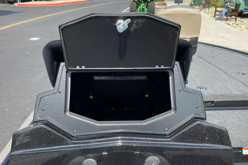 Slide: The Image of Open storage compartment on a 2027 Nitro Z19 XL boat, parked on a street. - 23