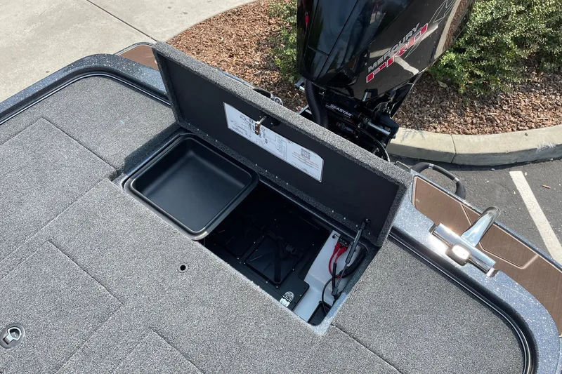 Slide: The Image of Open storage compartment on 2027 Nitro Z19 XL boat with Mercury engine. - 21