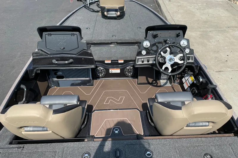 Slide: The Image of Interior view of 2027 Nitro Z19 XL boat with steering wheel and seating. - 12