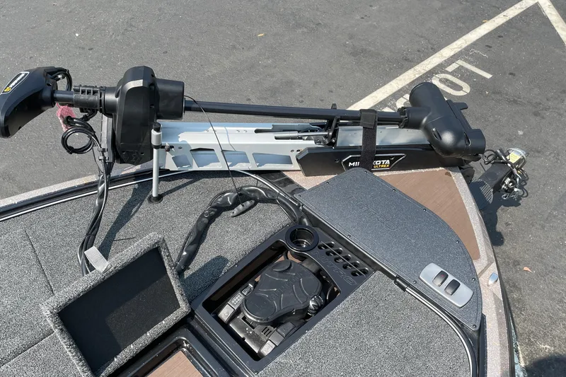 Slide: The Image of 2027 Nitro Z19 XL boat deck with Minn Kota trolling motor and control panel. - 35