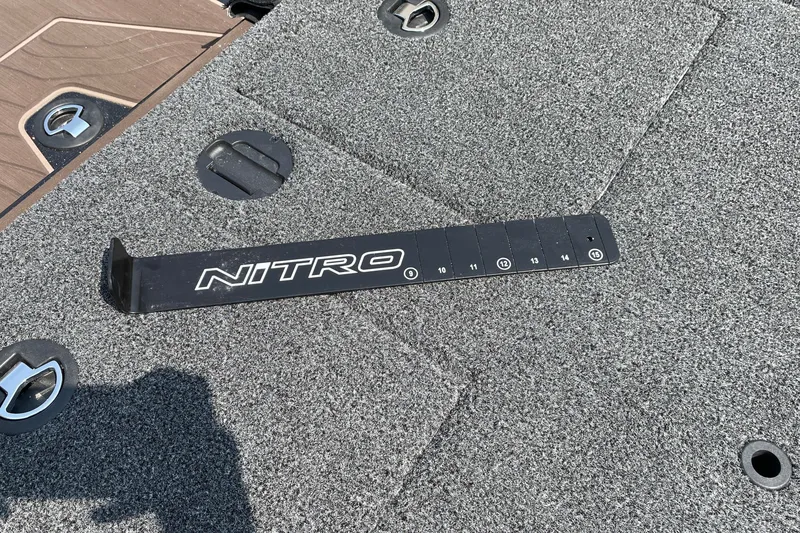 Slide: The Image of Nitro Z19 XL 2027 boat deck with measurement tool and textured surface. - 19