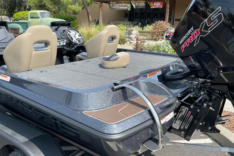 Slide: The Image of 2027 Nitro Z19 XL boat with Mercury Pro XS engine, featuring sleek design and comfortable seating. - 11