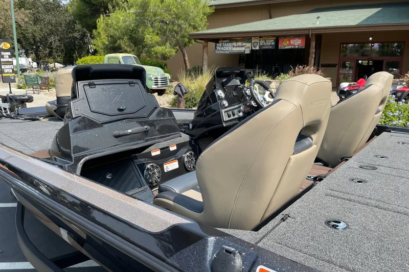 Slide: The Image of 2027 Nitro Z19 XL boat interior with beige seats and control panel. - 9