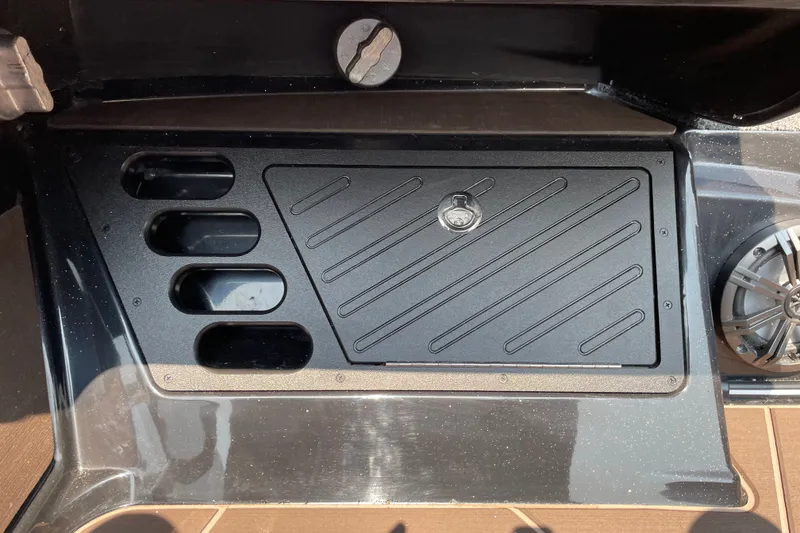 Slide: The Image of Storage compartment on a 2027 Nitro Z19 XL boat, featuring sleek design and speaker. - 24