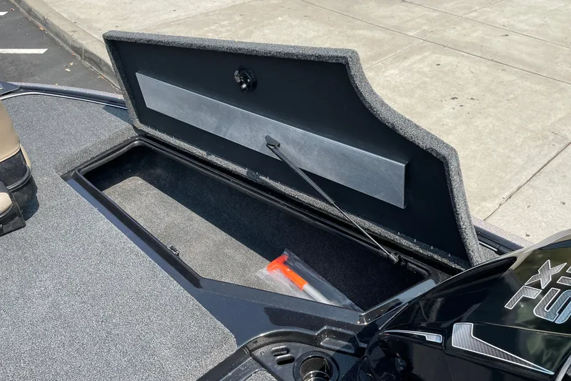 Slide: The Image of Open storage compartment on a 2027 Nitro Z19 XL boat, showing interior details. - 31