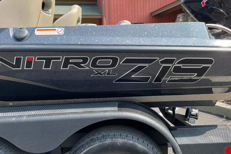 Slide: The Image of 2027 Nitro Z19 XL boat side view with logo and sleek design. - 39