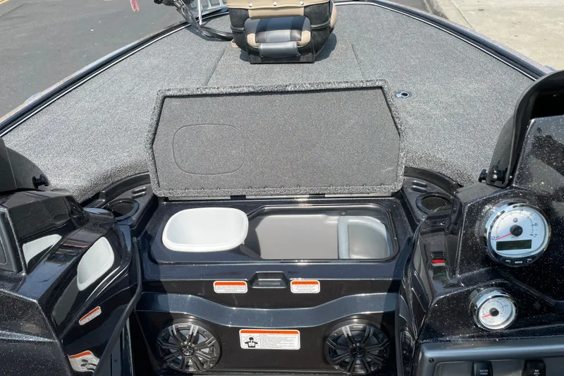 Slide: The Image of 2027 Nitro Z19 XL boat interior with open storage compartment and dashboard controls. - 28