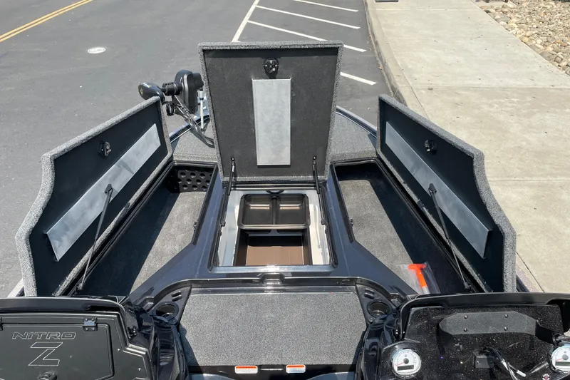 Slide: The Image of 2027 Nitro Z19 XL boat storage compartments open, showcasing spacious interior design. - 33