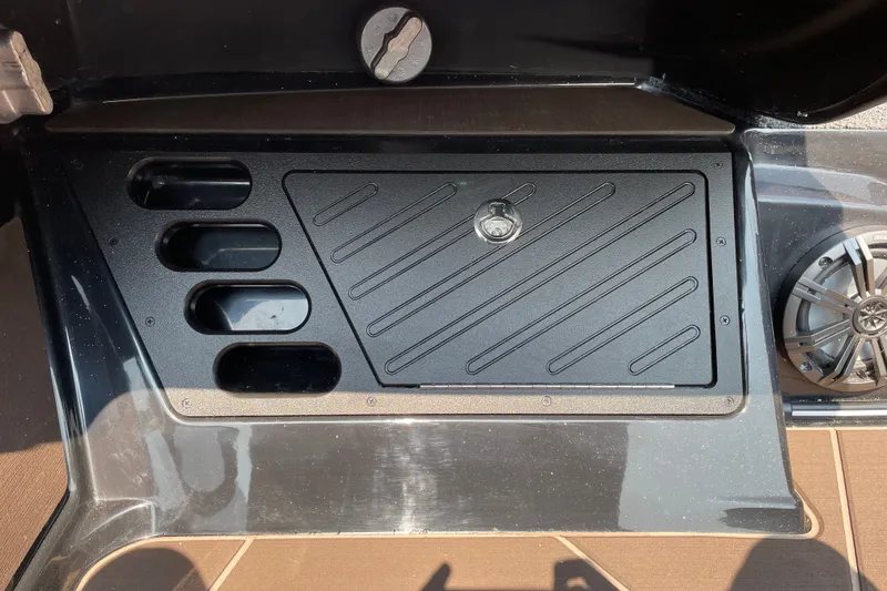 Slide: The Image of 2027 Nitro Z19 XL boat dashboard with storage compartment and speaker. - 25