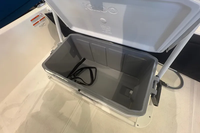 Slide: The Image of Open storage compartment on 2027 Mako Pro Skiff 17 CC boat. - 15