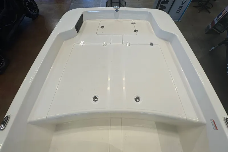 Slide: The Image of 2027 Mako Pro Skiff 17 CC boat deck, featuring a clean, spacious layout. - 7