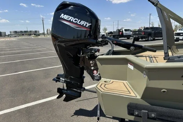Slide: The Image of Tracker Grizzly 1650 T Prairie Wings Edition 2027 with Mercury outboard motor in parking lot. - 47