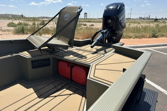Slide: The Image of 2027 Tracker Grizzly 1650 T Prairie Wings Edition boat with motor and seating. - 15