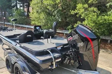 Slide: The Image of 2027 Nitro Z19 XL boat with powerful outboard motor, parked on a trailer. - 1