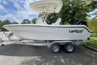 The Image of 2027 Mako 226 Center Console boat on trailer, parked outdoors. - 0