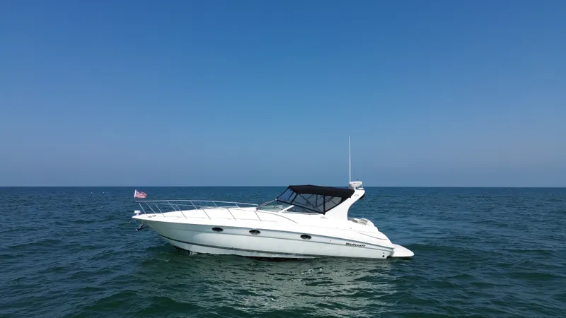 The Image of A 2002 Wellcraft 3700 Martinique on open water with a clear sky. - 0