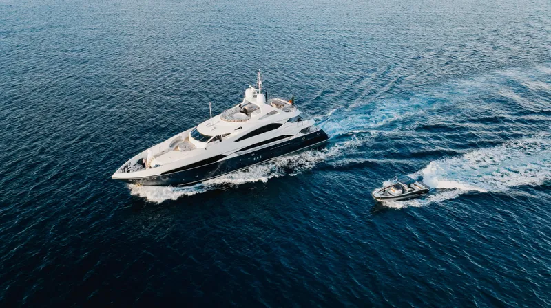 Slide: The Image of Aerial view of 2009 Sunseeker 121 yacht cruising with a smaller boat. - 28