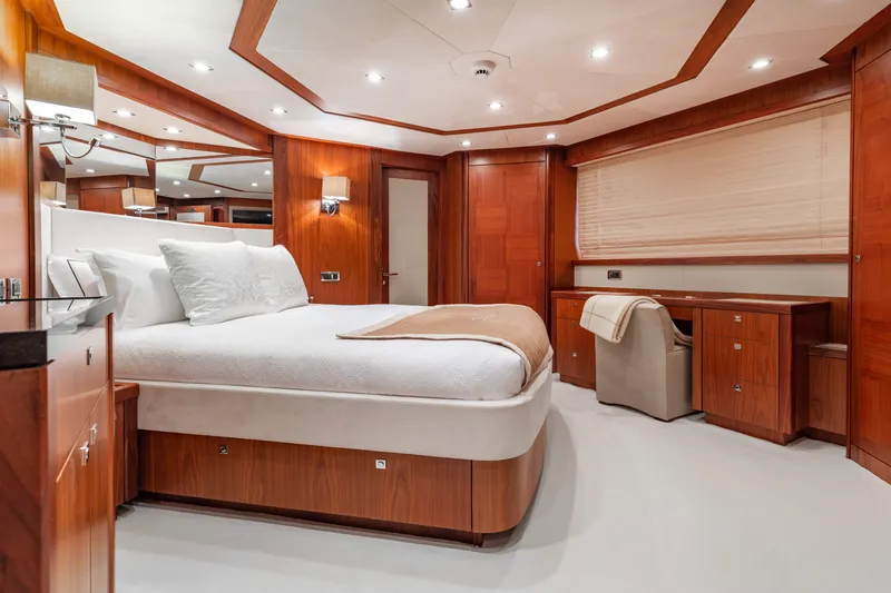 Slide: The Image of Luxurious bedroom interior of 2009 Sunseeker 121 yacht with wooden furnishings and modern lighting. - 17