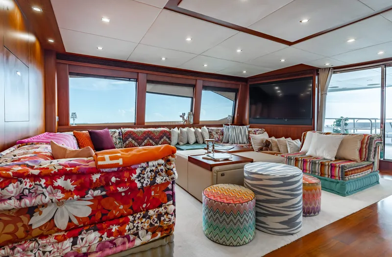 Slide: The Image of Luxurious Sunseeker 121 yacht interior, 2009 model, featuring vibrant, cozy seating and large windows. - 25