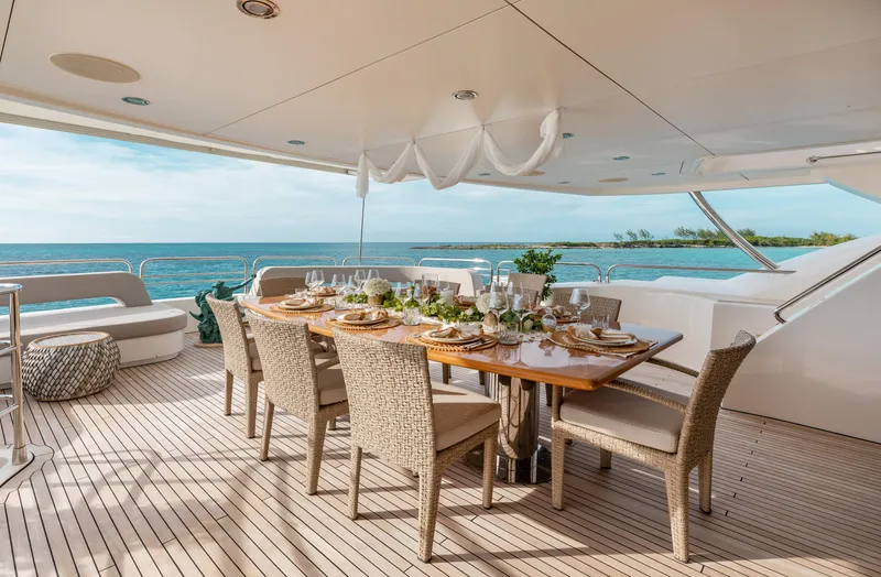 Slide: The Image of Luxurious dining area on a 2009 Sunseeker 121 yacht with ocean view. - 26