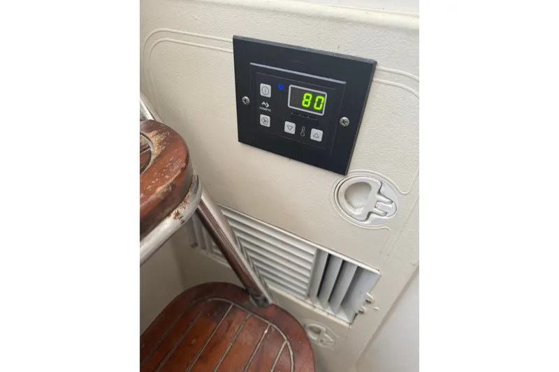 Slide: The Image of Control panel on a 2004 Century 2600 Walk-Around boat interior. - 10