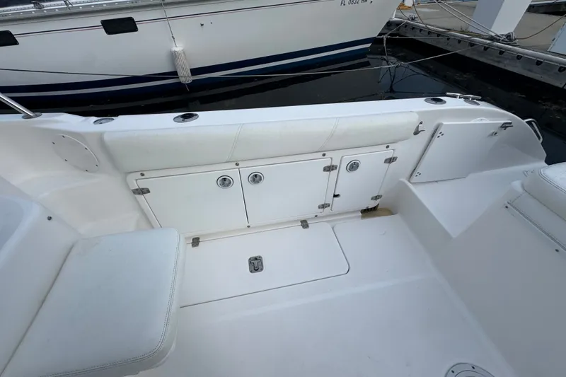 Slide: The Image of 2004 Century 2600 Walk-Around boat interior with storage compartments and seating. - 18