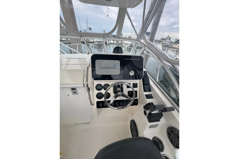 Slide: The Image of Helm of 2004 Century 2600 Walk-Around boat with Garmin navigation system. - 5