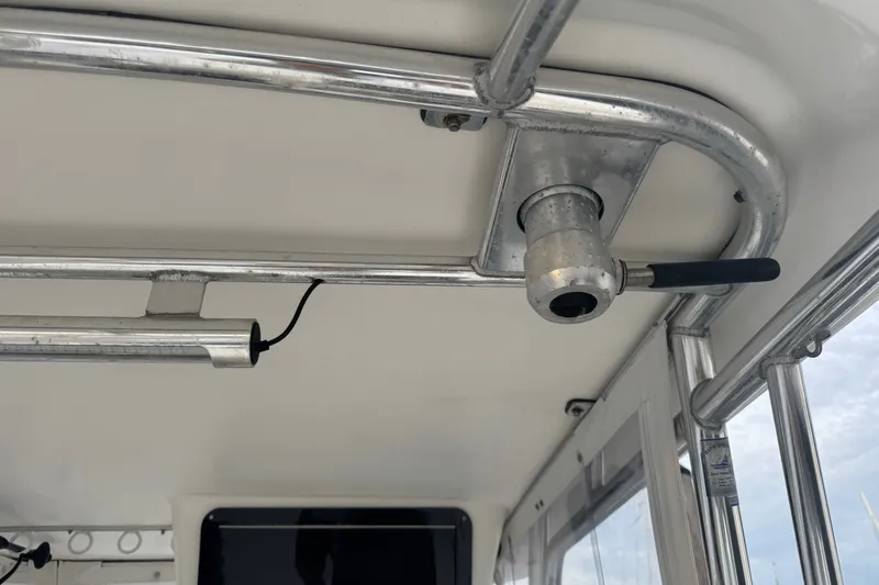Slide: The Image of Interior view of a 2004 Century 2600 Walk-Around boat's metal framework and fittings. - 24