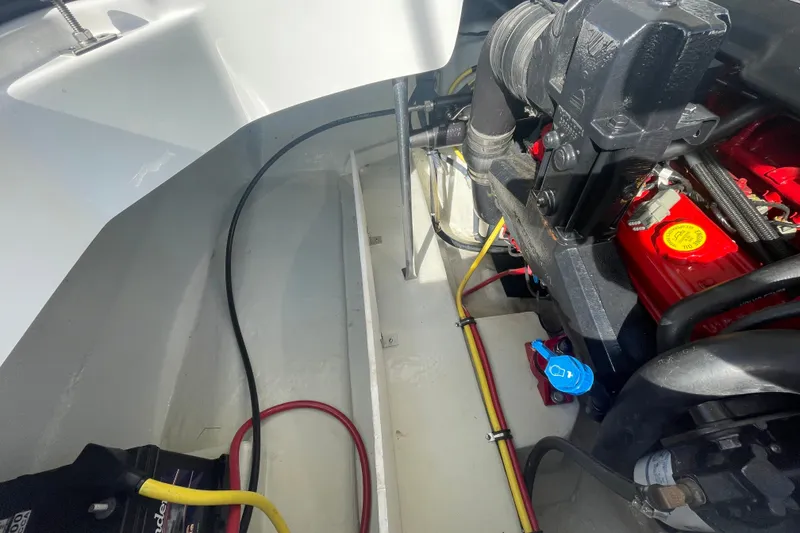 Slide: The Image of Engine compartment of a 2008 Cobalt 202 boat, showing wiring and engine components. - 14