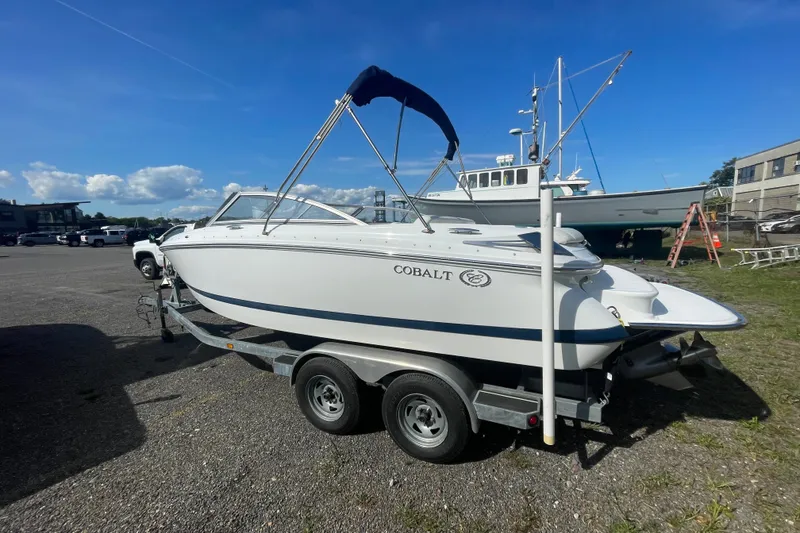 Slide: The Image of 2008 Cobalt 202 boat on trailer under clear blue sky. - 16