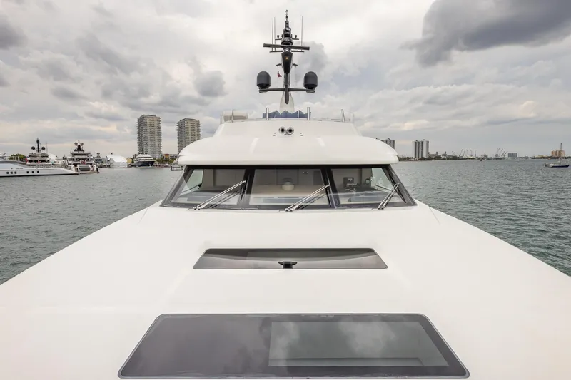 Slide: The Image of Sanlorenzo SD112 yacht, 2019 model, docked with city skyline and cloudy sky. - 39