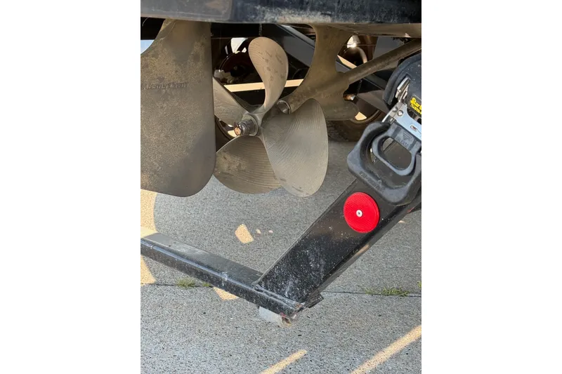 Slide: The Image of Propeller and trailer hitch of a 2013 MasterCraft XStar boat. - 2