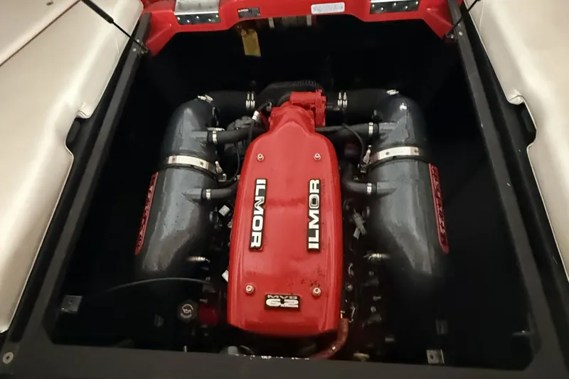 Slide: The Image of 2013 MasterCraft XStar engine featuring Ilmor branding in a boat compartment. - 3