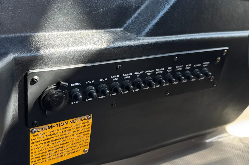 Slide: The Image of Control panel of a 2011 Axis A22 boat with labeled switches and exemption notice. - 31