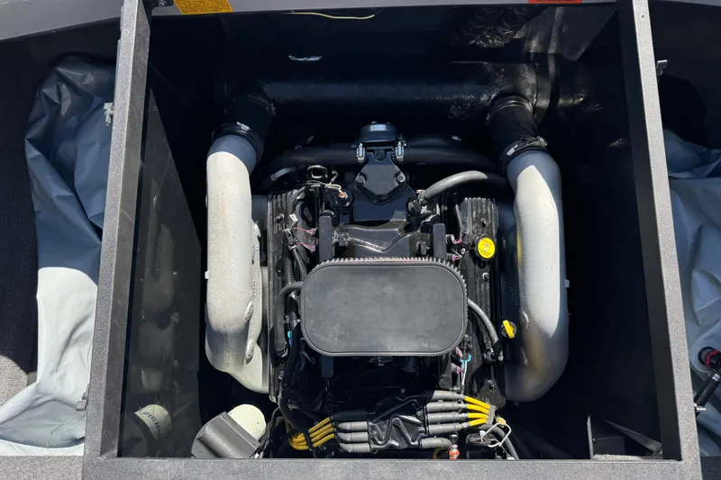 Slide: The Image of Engine compartment of a 2011 Axis A22 boat, showcasing detailed components. - 23
