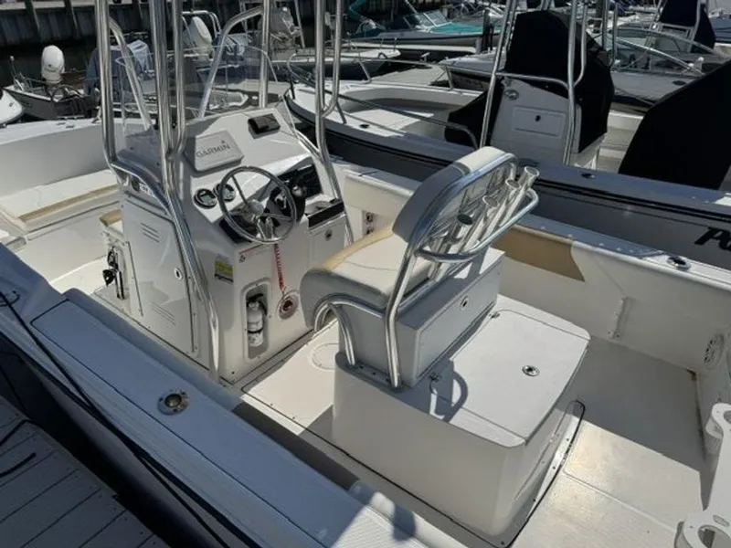 Slide: The Image of The image shows a 2023 Edgewater 188CC boat with a helm and seating area. - 5