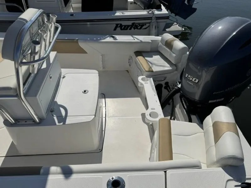 Slide: The Image of The image shows the cockpit of a 2023 Edgewater 188CC boat with a 150 HP outboard motor. - 6