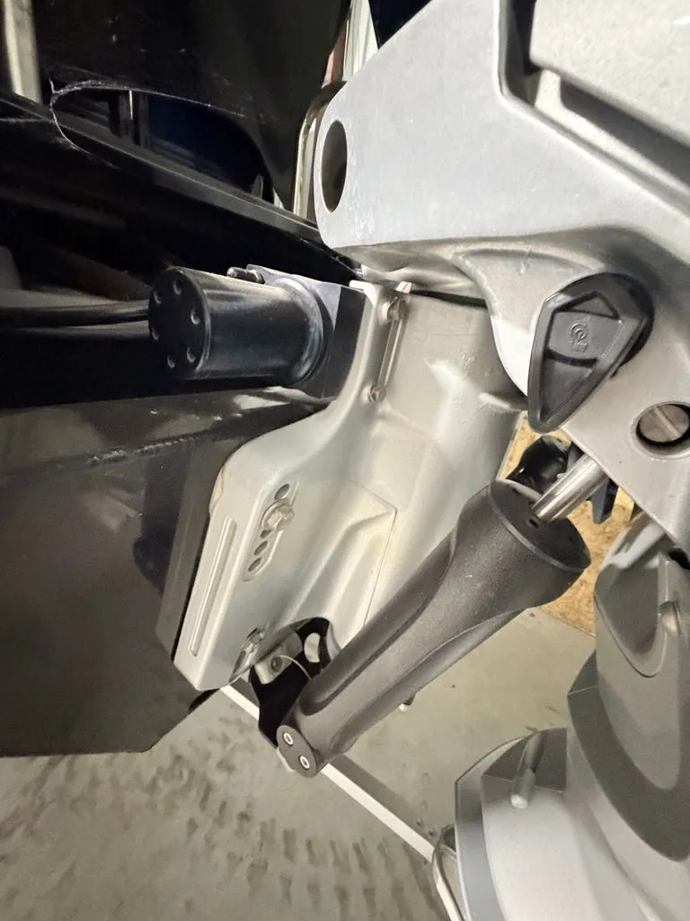 Slide: The Image of Close-up of a boat outboard motor with lever and controls. - 27