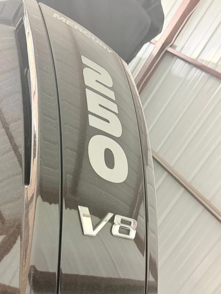 Slide: The Image of Close-up of a Mercury 250 V8 outboard motor in a storage facility. - 24