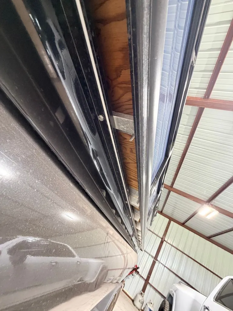 Slide: The Image of Close-up of a boat in a warehouse, showing the shiny exterior surface. - 31