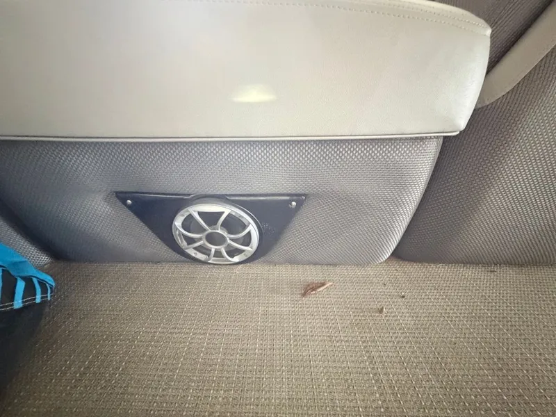 Slide: The Image of Close-up of a speaker in a boat with gray upholstery. - 18